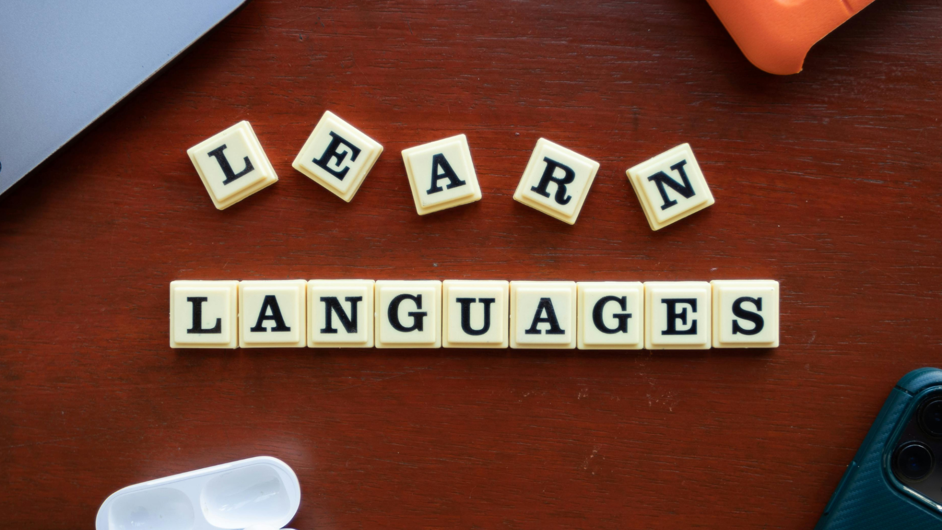 Scrabble letters spelling out 'Learn Languages'